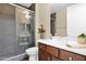 Bathroom features a double sink vanity, a tiled shower with glass doors and decorative flower vase at 27000 N Alma School Pkwy # 1032, Scottsdale, AZ 85262