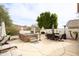 Backyard with spa, outdoor furniture, barbeque, and low maintenance desert landscaping at 301 E Ashurst Dr, Phoenix, AZ 85048