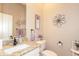 Bathroom with granite counters, neutral walls, and decorative artwork at 301 E Ashurst Dr, Phoenix, AZ 85048