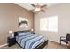 Cozy bedroom with a ceiling fan, ample natural light, and neutral color scheme at 301 E Ashurst Dr, Phoenix, AZ 85048