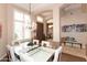 Dining room featuring a chandelier, tile and wood flooring, and natural light from the windows at 301 E Ashurst Dr, Phoenix, AZ 85048