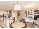 Spacious kitchen with barstool seating at the island and an open view into the living spaces at 301 E Ashurst Dr, Phoenix, AZ 85048