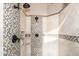 Walk-in shower with stylish tile, dual shower heads, and elegant fixtures at 301 E Ashurst Dr, Phoenix, AZ 85048