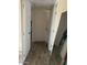 Hallway featuring doors and wood floors at 3431 W Campbell Ave, Phoenix, AZ 85017