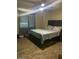 Main bedroom features a bed, wood floors, and a ceiling fan at 3431 W Campbell Ave, Phoenix, AZ 85017