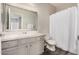 Bathroom with shower and curtain, a gray vanity and a modern framed mirror at 3830 E Lakewood Pkwy # 3164, Phoenix, AZ 85048