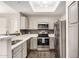 Bright kitchen featuring stainless steel appliances and stone countertops at 3830 E Lakewood Pkwy # 3164, Phoenix, AZ 85048