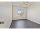 Bedroom featuring a window, modern fan, tile floors, and neutral paint at 3911 S 100Th Gln, Tolleson, AZ 85353