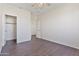 Bedroom with a ceiling fan, tile floors, neutral walls and a closet at 3911 S 100Th Gln, Tolleson, AZ 85353