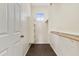 Walk-in closet with shelving, wooden rods, and a small window for ventilation at 3911 S 100Th Gln, Tolleson, AZ 85353