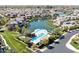 Community aerial view featuring a lake, pool and lush landscaping at 4077 S Sabrina Dr # 23, Chandler, AZ 85248