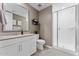 Bright bathroom features a glass-enclosed shower, modern vanity, and tile flooring at 4077 S Sabrina Dr # 23, Chandler, AZ 85248