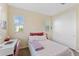 Bright bedroom with floral bedding, complemented by natural light streaming through the windows at 4077 S Sabrina Dr # 23, Chandler, AZ 85248