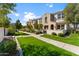 Charming townhome exterior with manicured lawn, walkway, and well-maintained landscaping, creating curb appeal at 4077 S Sabrina Dr # 23, Chandler, AZ 85248