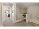 Upstairs hallway featuring carpeted flooring, access to rooms and a decorative plant at 4077 S Sabrina Dr # 23, Chandler, AZ 85248