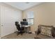 Carpeted home office with a window, sliding door closet, chair and dual monitor desktop setup at 4077 S Sabrina Dr # 23, Chandler, AZ 85248