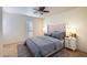 Charming bedroom with ceiling fan, plush bedding, and stylish nightstands at 4354 N 82Nd St # 182, Scottsdale, AZ 85251