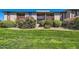 Building exterior featuring a large grassy area, bushes and flowers at 4354 N 82Nd St # 182, Scottsdale, AZ 85251