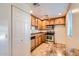 Bright kitchen with stainless steel appliances, tan cabinets, and stone countertops at 4354 N 82Nd St # 182, Scottsdale, AZ 85251