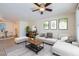 Cozy living room featuring a decorative brick wall, ceiling fan, and comfortable furniture at 4354 N 82Nd St # 182, Scottsdale, AZ 85251