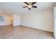 Spacious living room with tile floors, a white brick wall, and natural light at 4354 N 82Nd St # 182, Scottsdale, AZ 85251