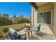Charming outdoor patio with comfortable seating and views of lush greenery and clear blue sky at 4354 N 82Nd St # 182, Scottsdale, AZ 85251