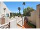 Exterior view of backyard with gated access, brick accents, and lush landscaping with palm trees at 5429 N 78Th St, Scottsdale, AZ 85250