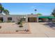 Charming single-story home showcasing desert landscaping, a covered parking space, and a well-maintained facade at 5429 N 78Th St, Scottsdale, AZ 85250