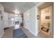 Hallway featuring tiled floors with access to a powder room and bedroom for convenient accessibility at 5429 N 78Th St, Scottsdale, AZ 85250