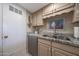 Kitchen sink area features stone countertops and classic cabinets at 5429 N 78Th St, Scottsdale, AZ 85250