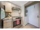 Modern kitchen with stainless steel oven and overhead vent at 5429 N 78Th St, Scottsdale, AZ 85250