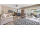 Cozy living room featuring bright windows, plush seating, neutral walls, and stylish décor at 5429 N 78Th St, Scottsdale, AZ 85250