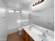 Clean bathroom featuring double sinks, a soaking tub, and tile flooring at 573 W Rattlesnake Pl, Casa Grande, AZ 85122