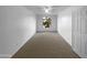 Bright bedroom with neutral carpet and a large window at 573 W Rattlesnake Pl, Casa Grande, AZ 85122