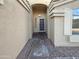 Inviting entryway with a covered porch and decorative details at 573 W Rattlesnake Pl, Casa Grande, AZ 85122