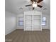 Bright living room featuring vaulted ceilings and built-in shelving at 573 W Rattlesnake Pl, Casa Grande, AZ 85122