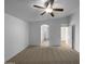 Main bedroom showcasing vaulted ceilings, a ceiling fan, and neutral carpeting at 573 W Rattlesnake Pl, Casa Grande, AZ 85122