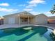 Backyard featuring a private in-ground pool and covered patio, perfect for outdoor enjoyment at 573 W Rattlesnake Pl, Casa Grande, AZ 85122