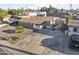 An aerial view of a charming single-story home with an extended driveway and basketball hoop at 6627 W Keim Dr, Glendale, AZ 85301