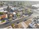 Aerial view displaying a residential property with mature trees, a well-kept yard, and convenient street parking at 6627 W Keim Dr, Glendale, AZ 85301