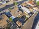 Aerial view showcasing a residential property with fenced yard, a storage shed, and convenient street parking at 6627 W Keim Dr, Glendale, AZ 85301