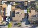 Aerial view of a well-maintained property featuring solar panels, a detached garage, and multiple parking spaces at 6627 W Keim Dr, Glendale, AZ 85301