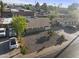 An aerial view of a charming single-story home with a minimalist rock garden at 6627 W Keim Dr, Glendale, AZ 85301