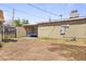 Spacious backyard with block wall, featuring covered seating area perfect for entertaining and outdoor relaxation at 6627 W Keim Dr, Glendale, AZ 85301