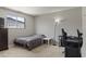 Bedroom with a desk, a window providing natural light, and neutral colored carpet at 6627 W Keim Dr, Glendale, AZ 85301