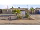 Charming single-story home with a minimalist rock garden in the front yard at 6627 W Keim Dr, Glendale, AZ 85301