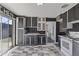 Stylish kitchen boasts black and white cabinetry, a red microwave, and sliding glass doors to the backyard at 6627 W Keim Dr, Glendale, AZ 85301