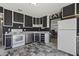 Well-equipped kitchen featuring modern appliances, sleek cabinetry, and an open layout to the adjacent room at 6627 W Keim Dr, Glendale, AZ 85301