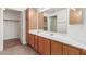 Well-lit bathroom with double sinks, lots of storage and a large mirror at 6770 N 47Th Ave # 1022, Glendale, AZ 85301