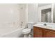 Well-lit bathroom features a tiled tub-shower combo and a wood vanity at 6770 N 47Th Ave # 1022, Glendale, AZ 85301